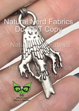 Load image into Gallery viewer, Silver metal zipper pull shaped like a dripping inky cap mushroom. The pull has a detailed design with a textured surface.