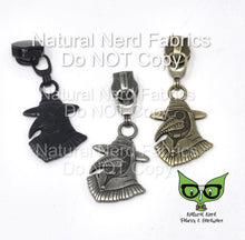 Load image into Gallery viewer, Three zipper pulls with a plague doctor design. The zipper pulls are in black, antique silver, and bronze.