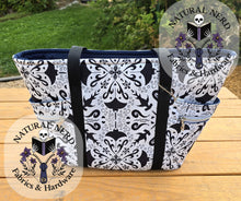 Load image into Gallery viewer, a large tote bag with a hammer head and mata ray fabric sitting on a wooden table against a grassy back ground