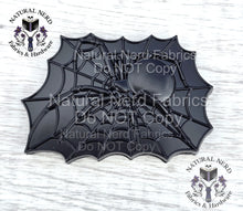 Load image into Gallery viewer, An black-colored metal spider web magnetic snap design with a spider in the center. The spider and web are detailed with intricate lines. The design is rectangular and has a matte finish.