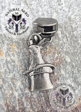 Load image into Gallery viewer, Antique nickel rabbit-in-a-hat zipper pull on a stone surface with 'Natural Nerd' branding.