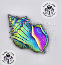 Load image into Gallery viewer, A matte rainbow conch shell-shaped magnetic snap.