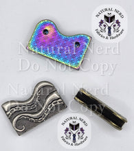 Load image into Gallery viewer, Two wavy octopus tentacle-shaped metal strap ends shown on a white background, one in silver-toned metal and one in rainbow-toned metal. A third matching piece is shown from the top. The rainbow is shown from the back