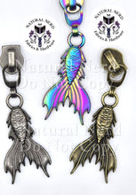 Load image into Gallery viewer, Three mermaid tail zipper pulls shown on a white background: one iridescent rainbow finish in the center, one antique bronze finish on the right, and one antique nickel finish on the left.