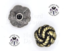 Load image into Gallery viewer, Two metal Chicago screw pieces on a white background: a round textured silver-toned piece at upper left shown from the bottom and a twisted rope design bronze-toned piece at lower right, with repeated 'Natural Nerd Fabrics & Hardware' logos and a faint 'Do Not Copy' watermark.