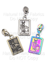Load image into Gallery viewer, Three zipper pulls with rectangular pendants. Each pendant features a horned figure and the text "Book Boyfriend." The pulls are silver, bronze, and iridescent with a rainbow effect.