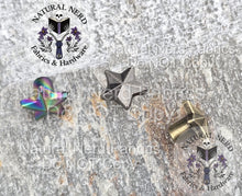 Load image into Gallery viewer, Metallic star-shaped Chicago screws on a textured surface with 'Natural Nerd' branding. Colors shown are matte rainbow, antique nickel, and bronze.
