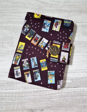 Load image into Gallery viewer, Folding wallet with tarot card design on a wooden surface
