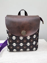 Load image into Gallery viewer, Brown leather backpack with skull pattern on a white surface
