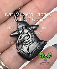 Load image into Gallery viewer,  Black metal zipper pull featuring a plague doctor with a long beak, wearing a hat and goggles. 

