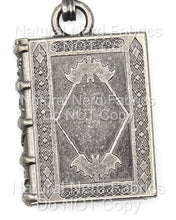 Load image into Gallery viewer, A silver-toned metal zipper pull shaped like a book with a bat design on the front. The book has a detailed, ornate design with a diamond pattern.
