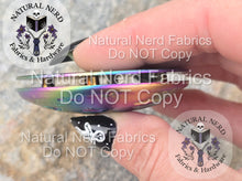 Load image into Gallery viewer, Hand holding a full moon snap to the side to show the domed curve of the top.
