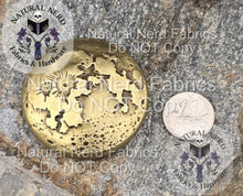 Load image into Gallery viewer, Bronze magnetic snap design to look like a full moon shown next to U.S. Quarter for scale.
