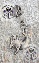 Load image into Gallery viewer, An antique nickel detailed zipper pull designed to look like a harbor seal. 
