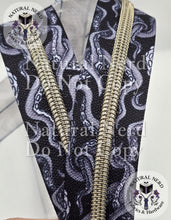 Load image into Gallery viewer, Black and white zipper tape with silver teeth and a tentacle design.
