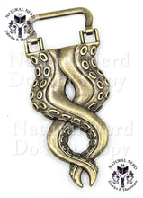 Load image into Gallery viewer, An antique bronze octopus tentacle strap anchor with detailed suckers, shown on a white background with 'Natural Nerd Fabrics &amp; Hardware' watermarks.
