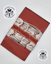 Load image into Gallery viewer, Shows the inside of an open embroidered tag, a red base with white string and an overlaid watermark text from Natural Nerd Fabrics &amp; Hardware.
